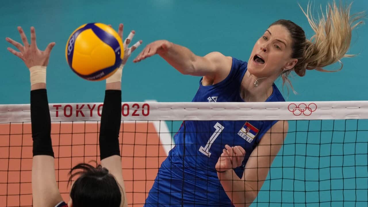 Serbia's Bianka Busa spikes the ball as Korea's Yeum Hye Seon defends during the bronze medal match in women's volleyball at the 2020 Summer Olympics, Sunday, Aug. 8, 2021, in Tokyo, Japan. (AP Photo/Frank Augstein)