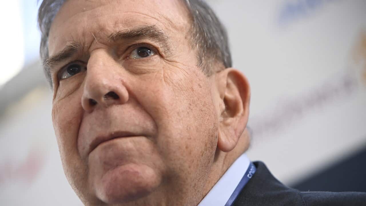 A man with a concerned expression on his face.