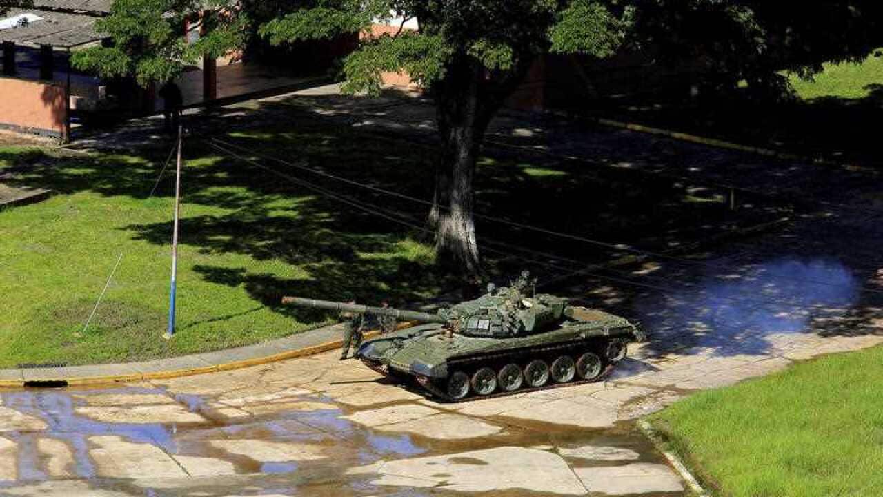 A tank of the Venezuelan Bolivarian National Army moves inside the military base Paramacay in Valencia, Venezuela.