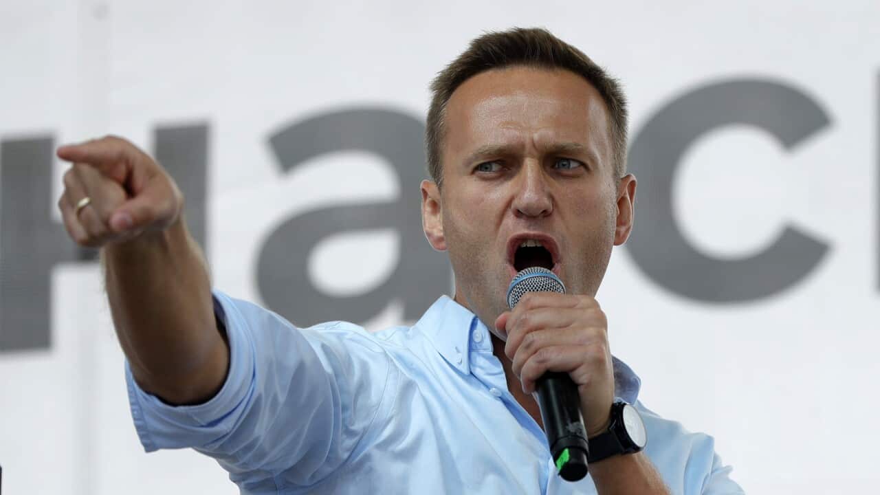 In this Saturday, July 20, 2019 file photo, Russian opposition activist Alexei Navalny gestures while speaking to a crowd during a political protest in Moscow
