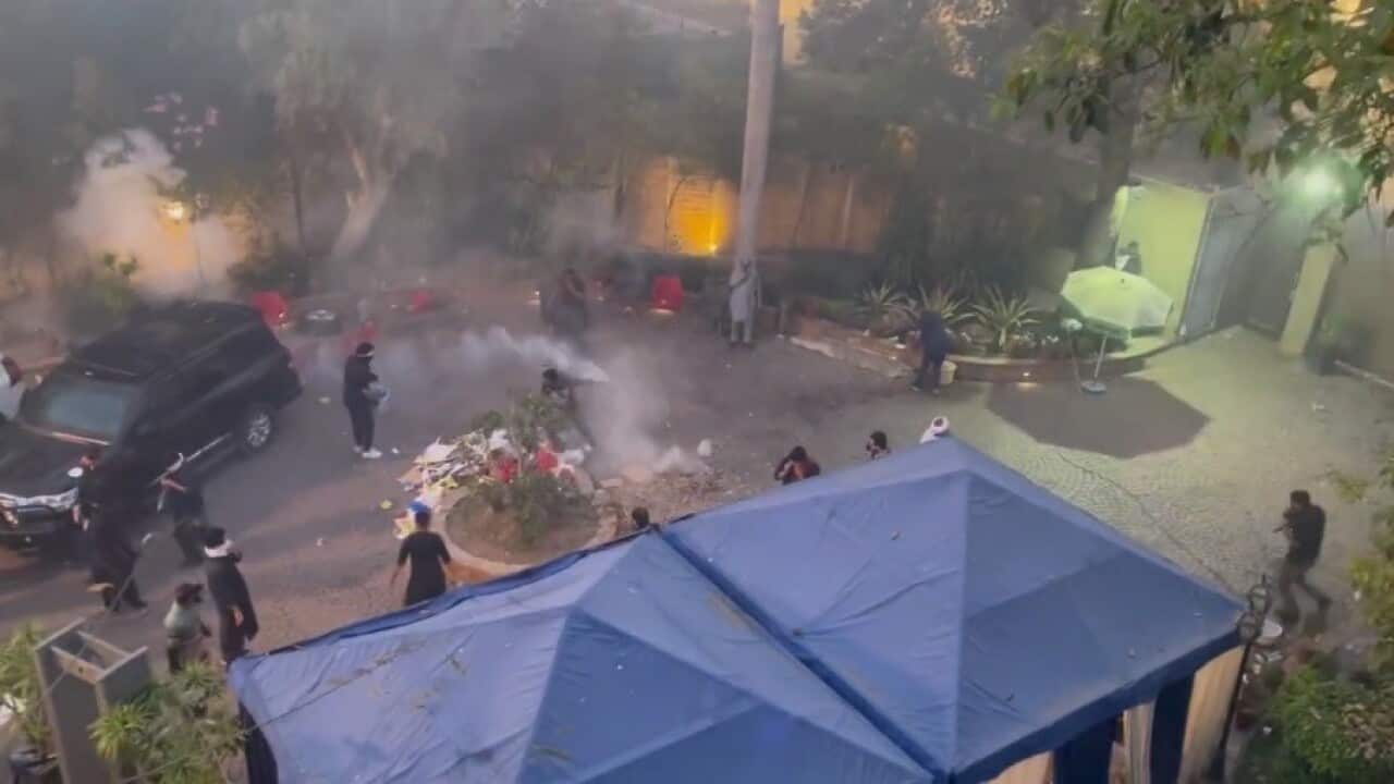 Tear gas shells, burnt tyres and vehicles litter the site of clashes; 30 policemen, including DIG, are injured; Imran says he’s ready to go to jail.