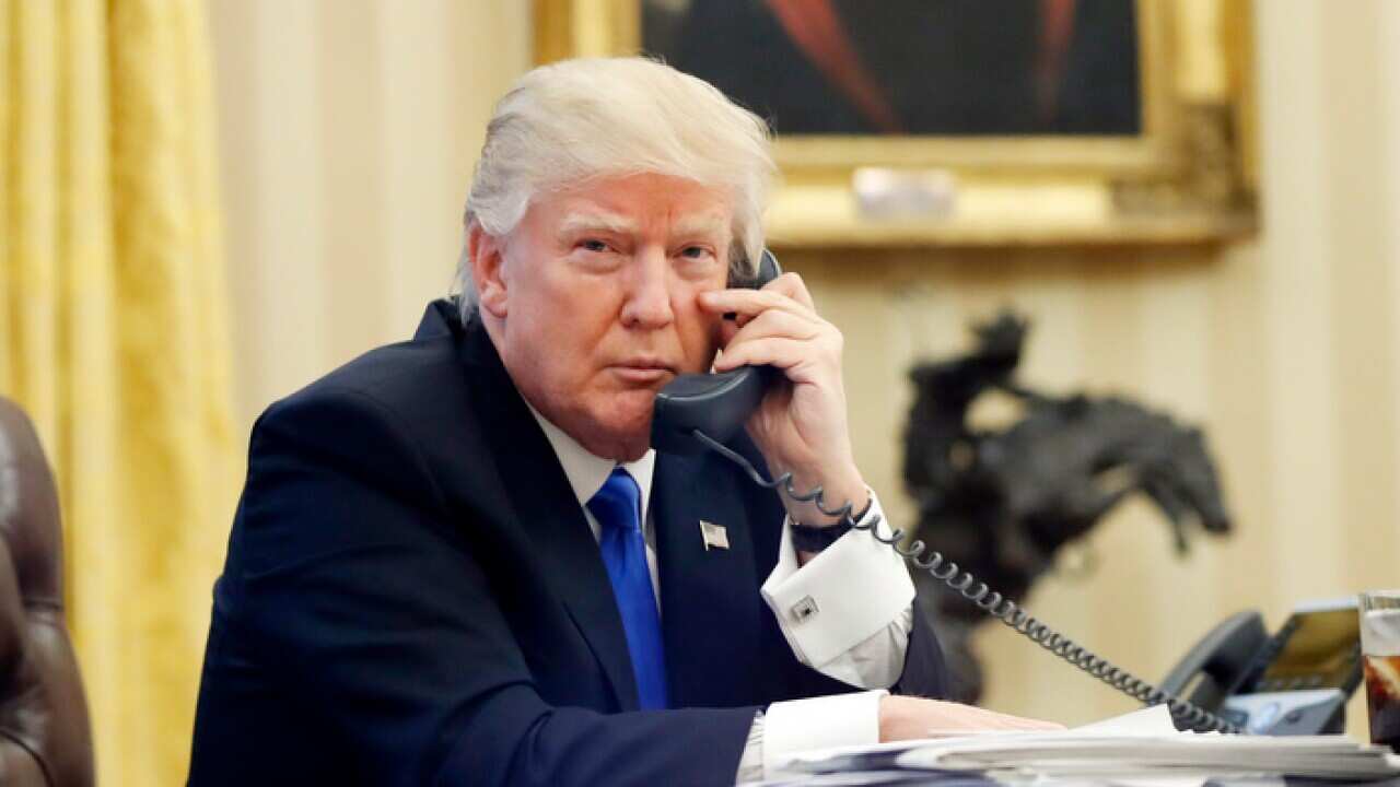 In this Jan. 28, 2017, file photo, U.S. President Donald Trump speaks on the phone with Prime Minister of Australia Malcolm Turnbull in the Oval Office of the White House in Washington. For decades, Australia and the U.S. have enjoyed the coziest of relat
