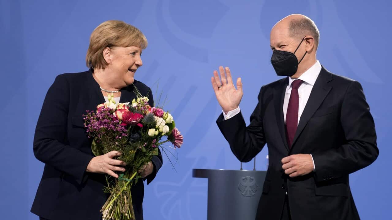 New elected German Chancellor Olaf Scholz and former Chancellor Angela Merkel during a handover ceremony in the chancellery in Berlin, Wednesday, Dec. 8, 2021. (Photo/Markus Schreiber)