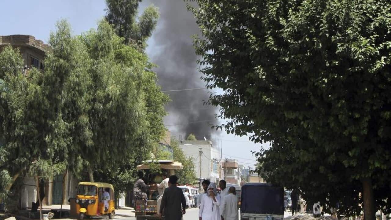 Smoke rises from a building after a deadly attack