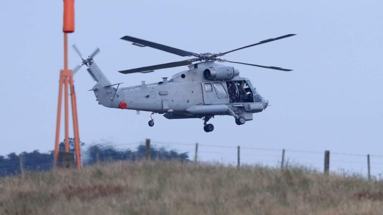 A New Zealand Navy helicopter takes off from Whakatane Airport as the mission to return victims of the White Island eruption begins in Whakatane, New Zealand.