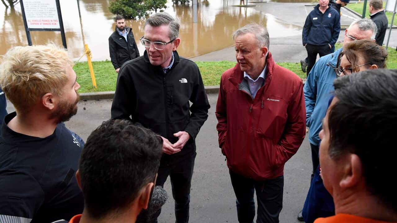 NSW Premier Dominic Perrottet (centre left) and Prime Minister Anthony Albanese (centre right) meet with SES volunteers in Richmond, NSW July 6, 2022