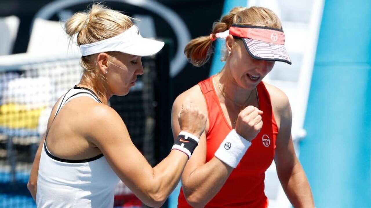 Caption: Elena Vesnina and Ekatarina Makarova of Russia celebrate a point during their first round doubles match against Shuko Aoyama and Makoto Ninomiya of Japan on day three of the 2017 Australian Open at Melbourne Park on January 18, 2017 in Melbourne,