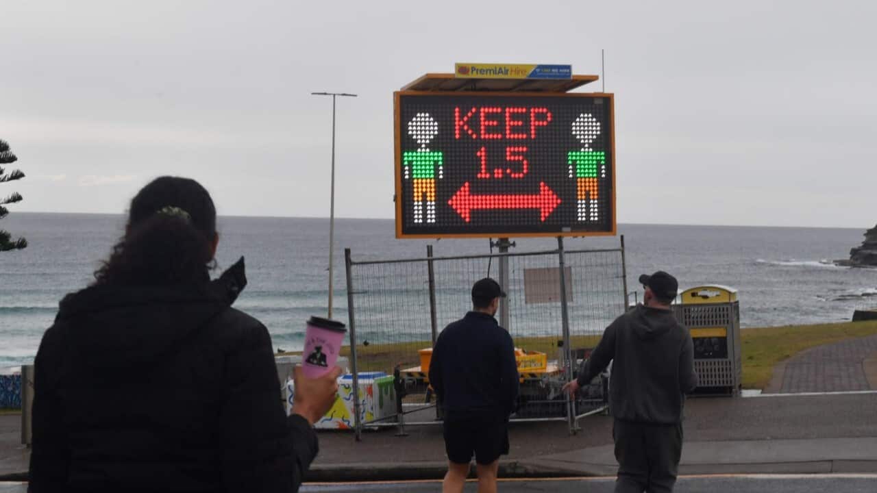 A Covid warning sign is seen at Bondi Beach in Sydney (AAP).jpg