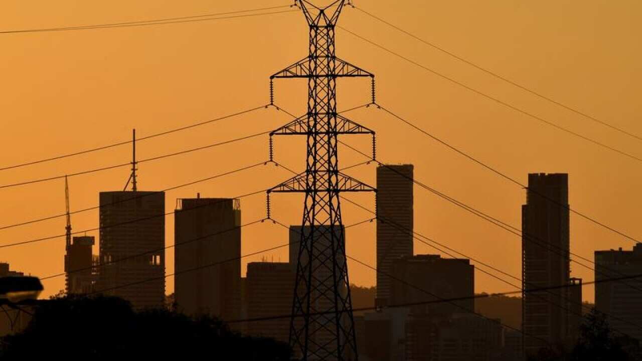 A high voltage electricity transmission tower is seen.