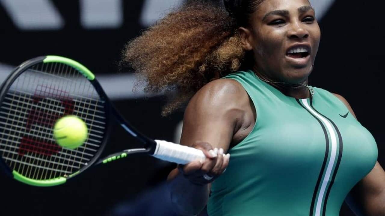 United States' Serena Williams hits a forehand return.