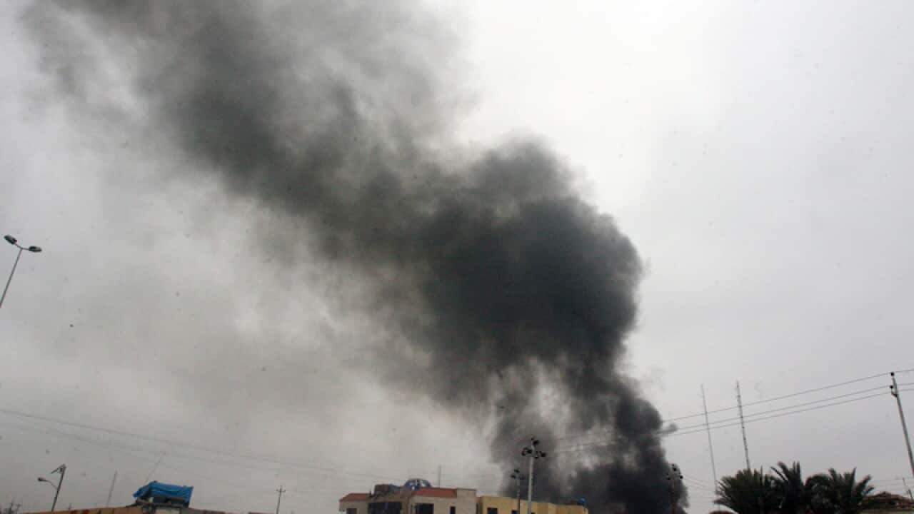 Smoke rises from the local council's building in Fallujah