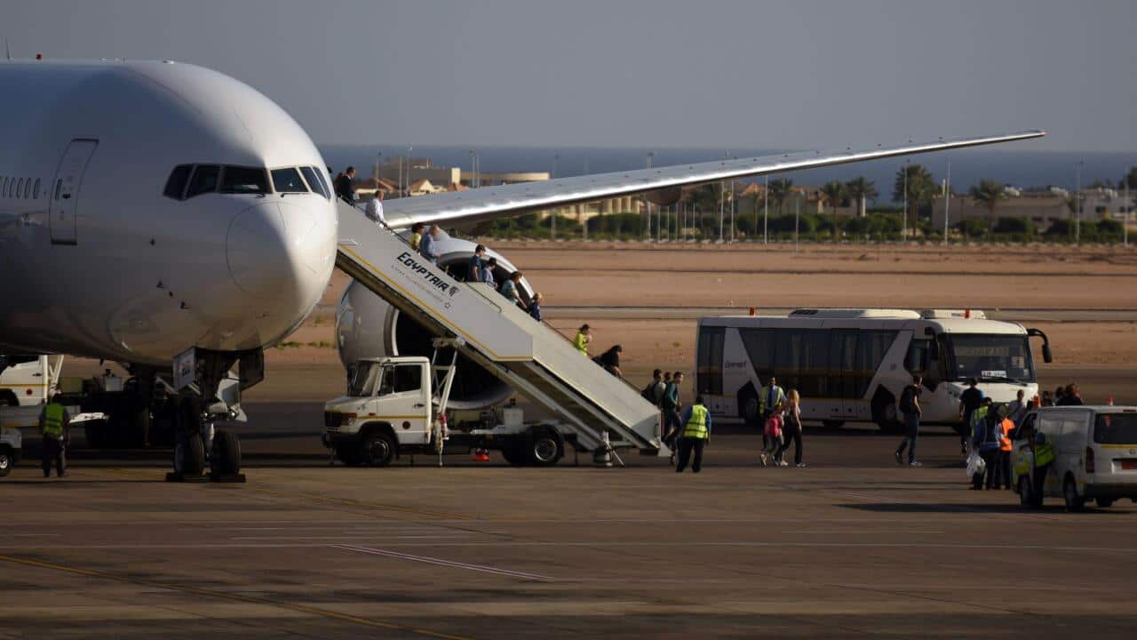 Tourists disembark an Egypt Air plane at the airport in Egypt's Red Sea resort of Sharm el-Sheikh