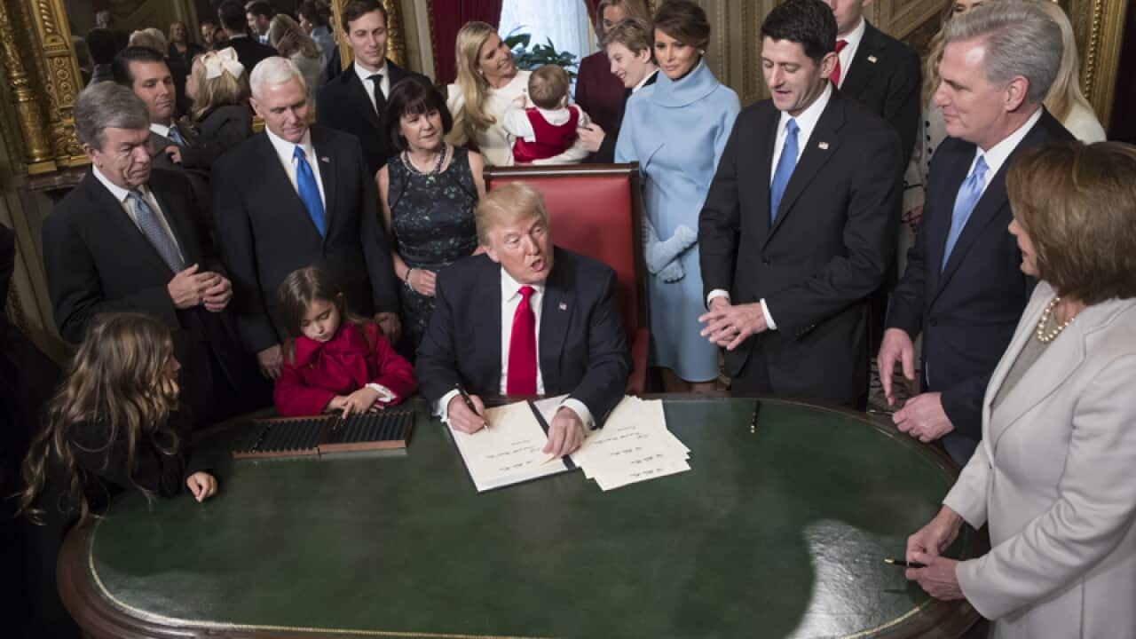 Donald Trump formally signs his cabinet nominations into law