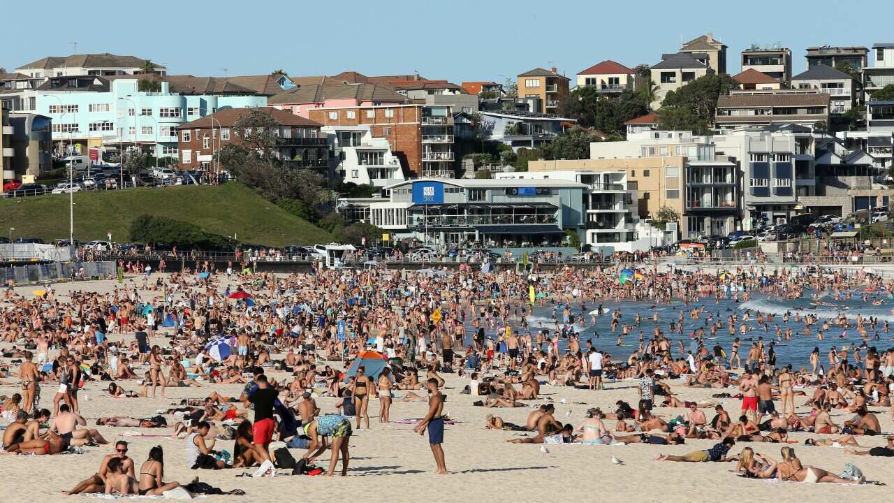 Beachgoers visit Bondi Beach despite the threat of Covid-19 Coronavirus on Friday, 20 March 2020.