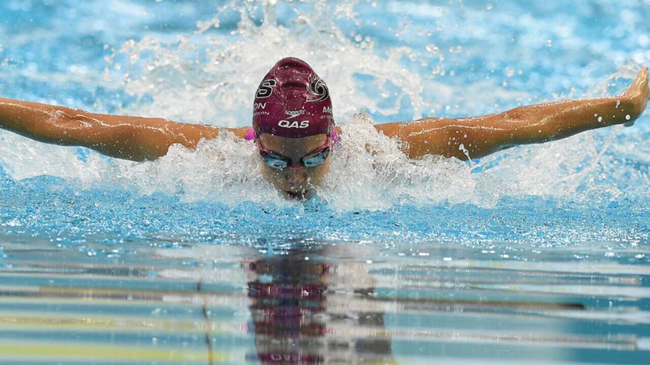 Emma McKeon swims during the Women's 100m Butterfly Final