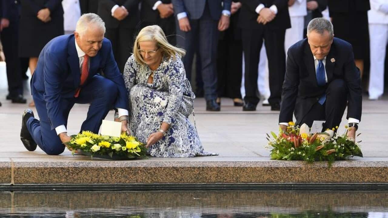 Malcolm Turnbull, his wife Lucy and Bill Shorten lay a wreath.