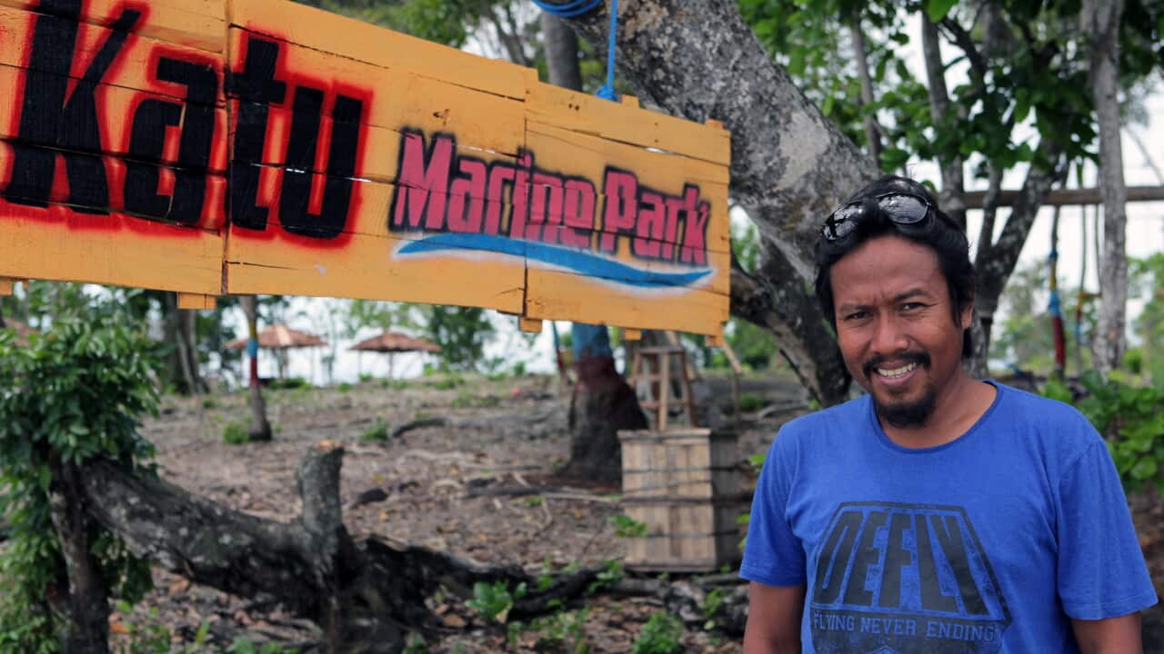 Arifuddin poses for a photograph in Poso