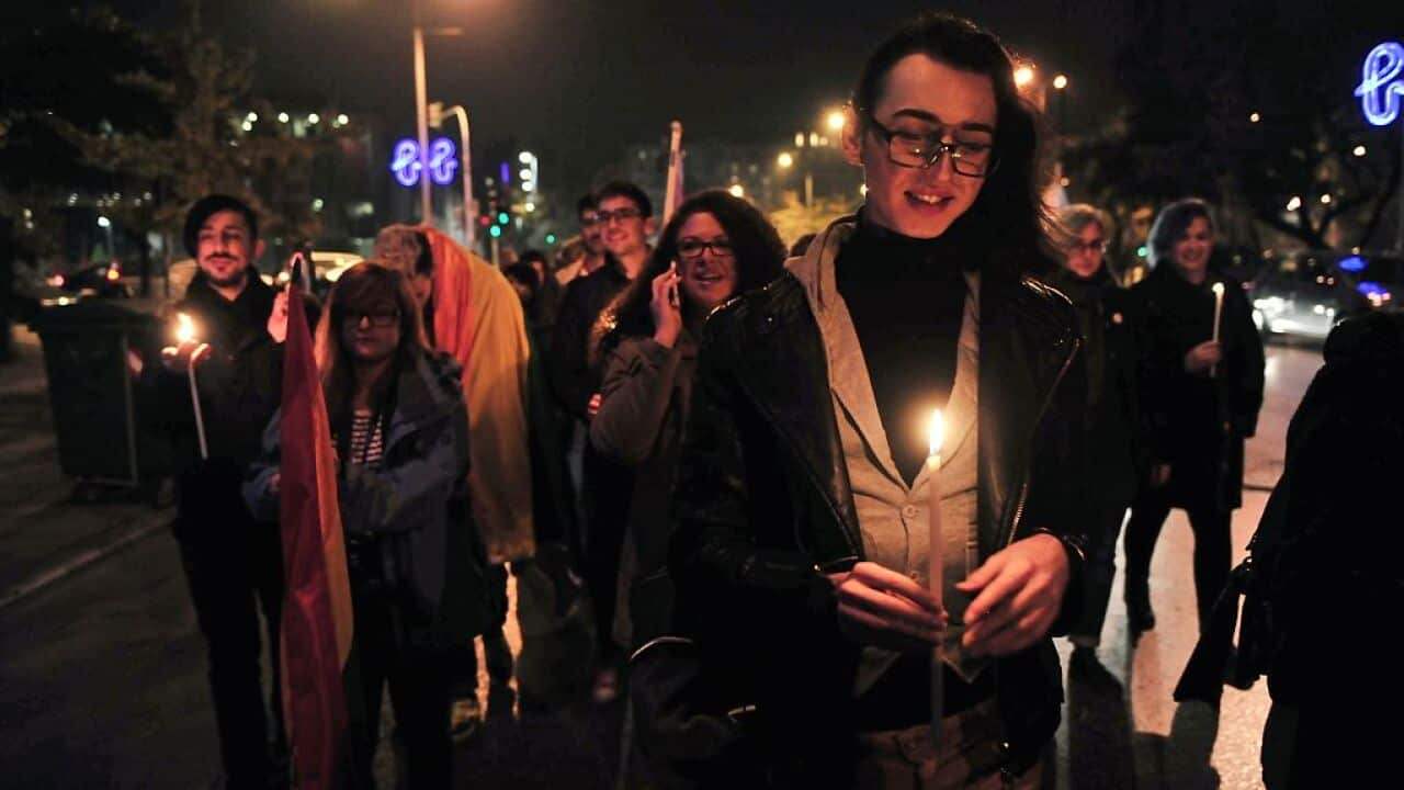 Demonstrators hold candles during a protest march for the International Transgender Day of Remembrance in Thessaloniki on November 25, 2016. / AFP / SAKIS MITROLIDIS (Photo credit should read SAKIS MITROLIDIS/AFP/Getty Images)