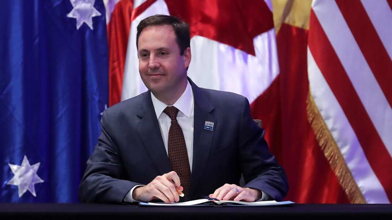 Australia's Investment, Tourism and Commerce Minister Steven Ciobo signs the the Trans-Pacific Partnership in Santiago, Chile.