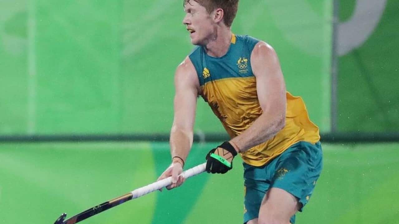 A file image of Australian defender Matthew Dawson (R)