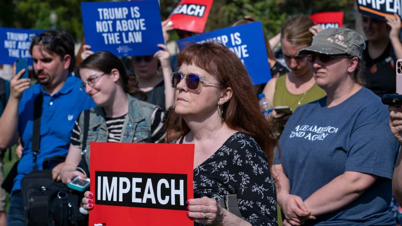 Activists rally for the impeachment of President Donald Trump, at the Capitol in Washington, Thursday, Sept. 26, 2019.