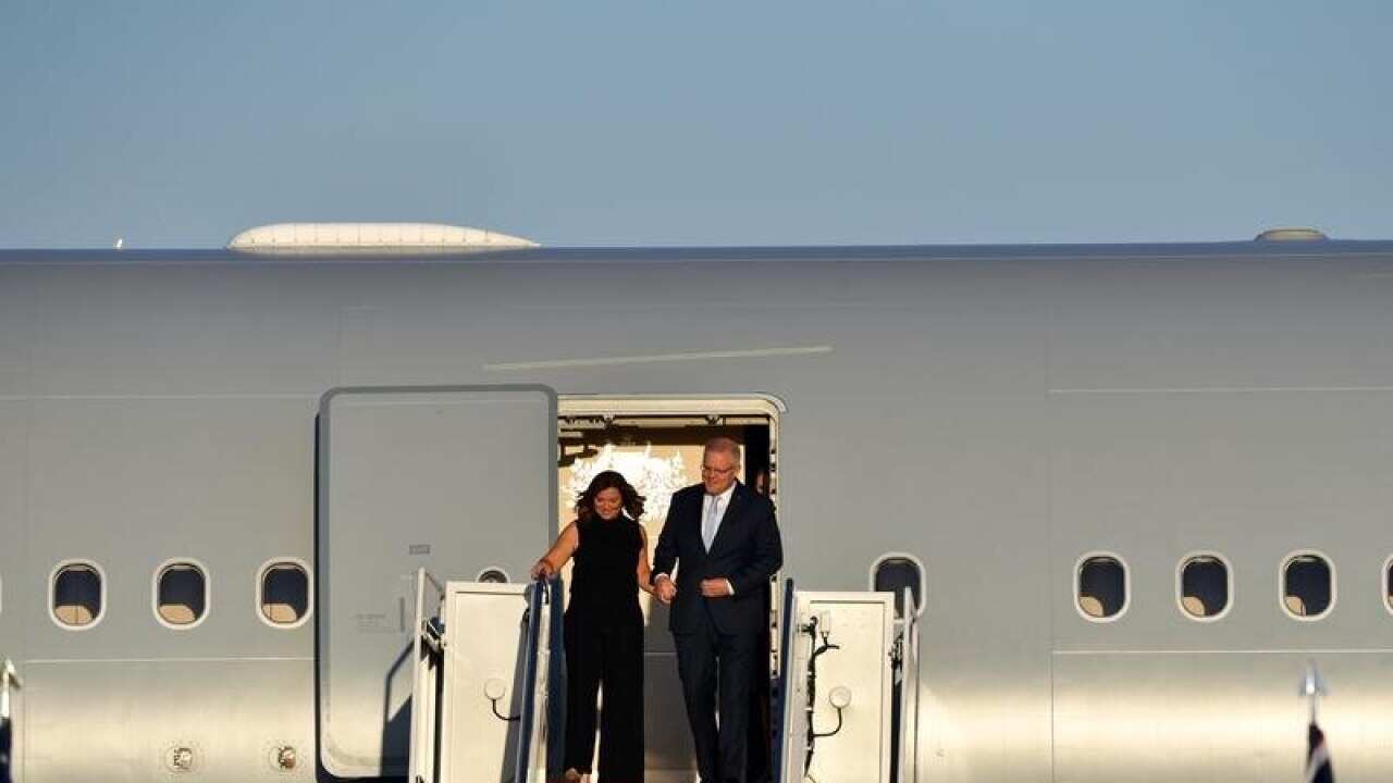 Scott and Jenny Morrison disembark from 'Shark One'.