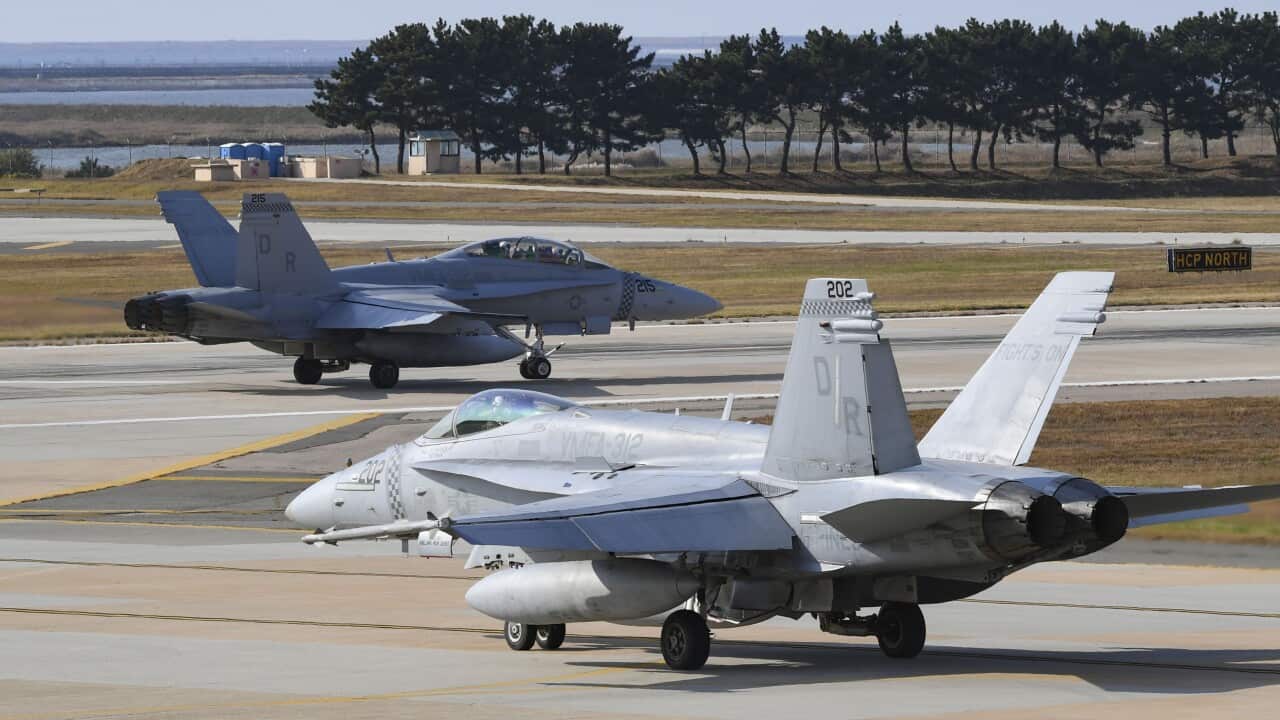 US Air Force jets on the tarmac.