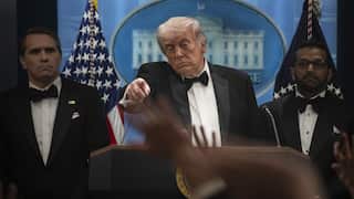 US President Donald Trump points to journalists during media questioning.