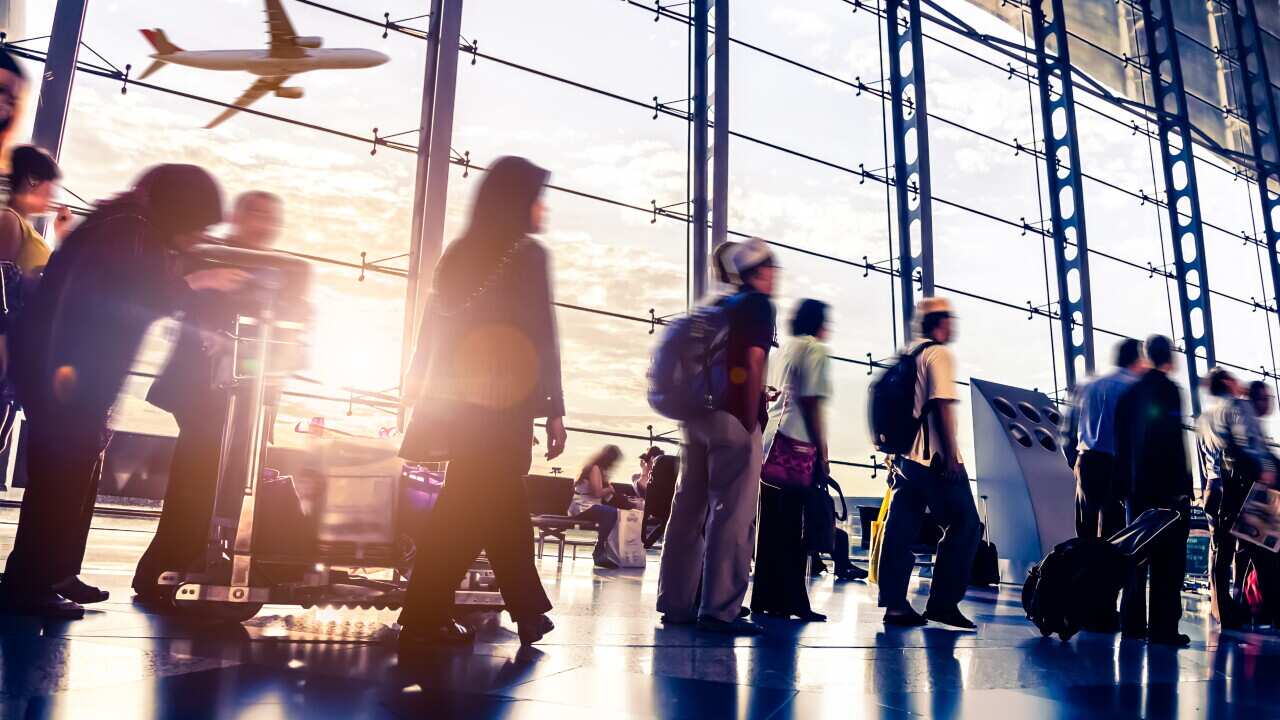 Blurred shot of people walking through Malaysia airport