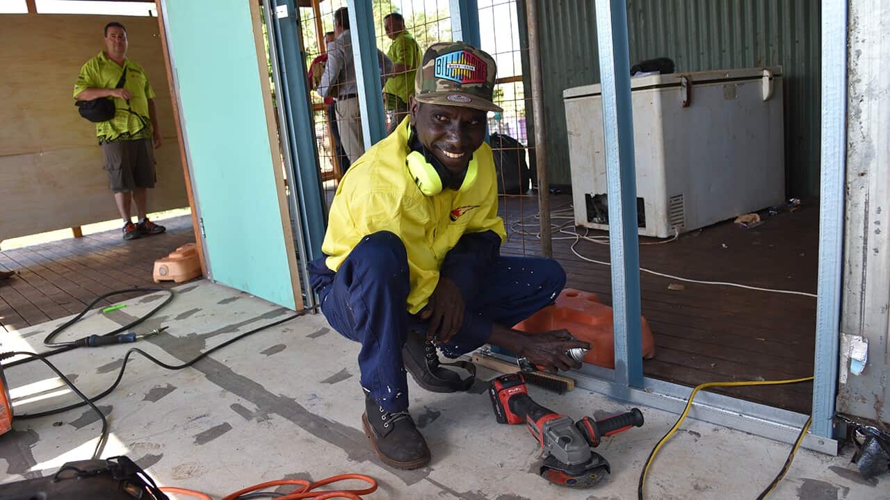 Worker with power tool