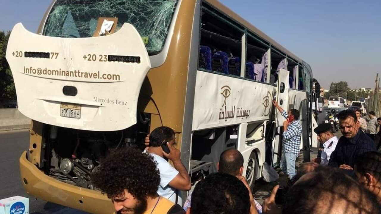 The bus with its shattered windows