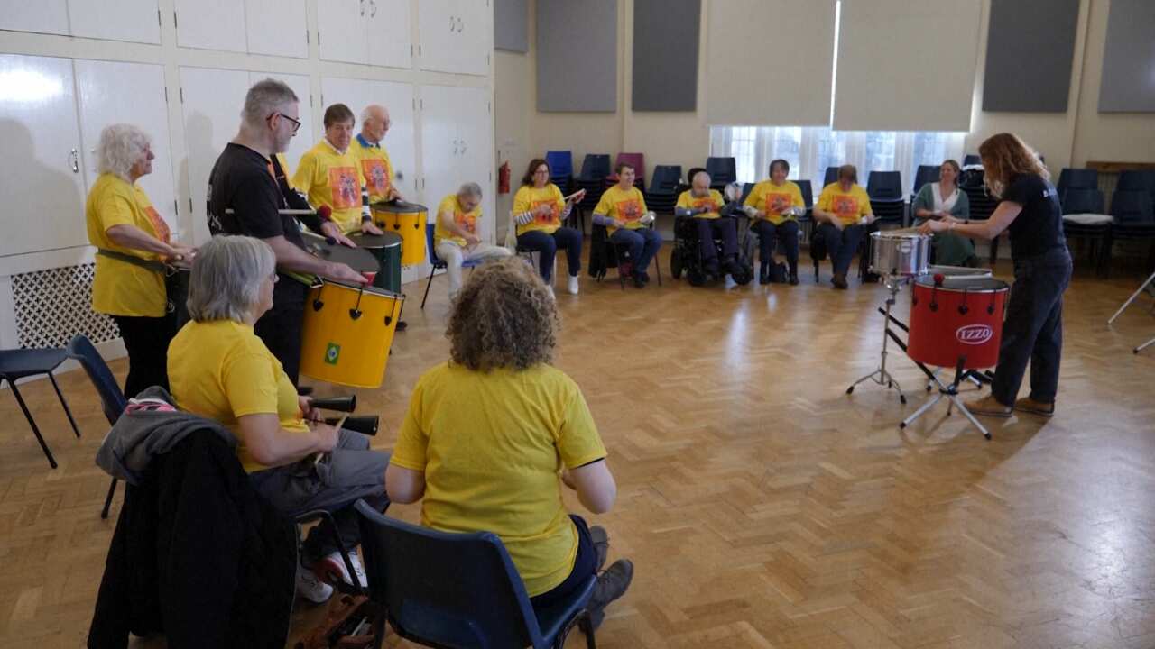 Parkinson's patients enjoying a Samba drumming class in Cardiff, Wales (AP).png