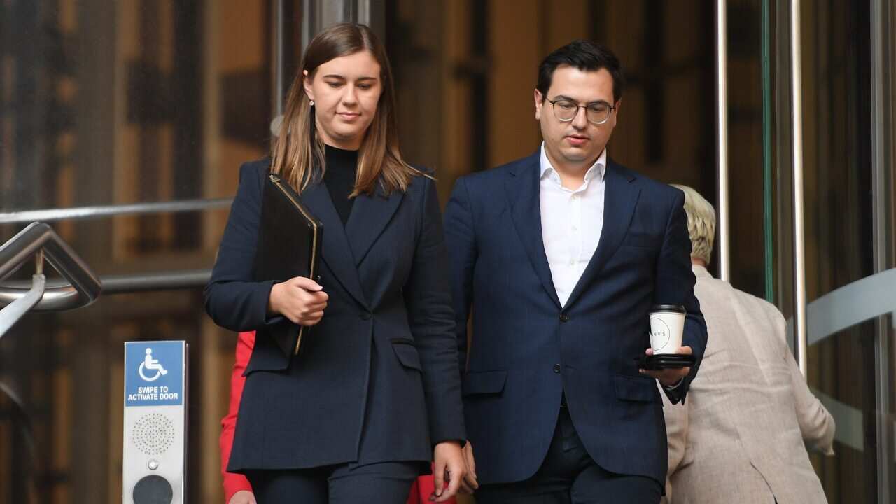 Former political staffer Brittany Higgins (centre) and her partner David Shiraz.