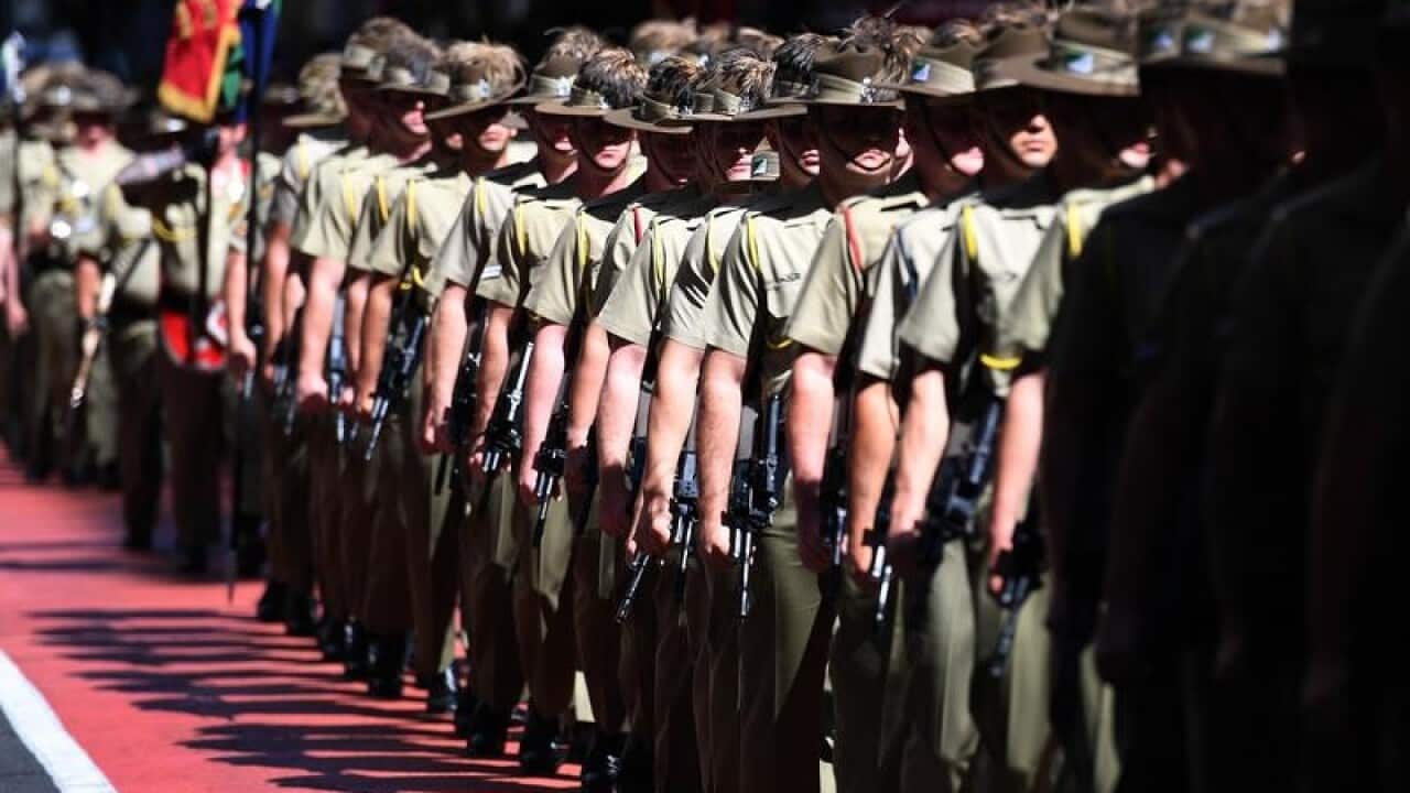 Defence forces veterans and service people at an ANZAC Day march.