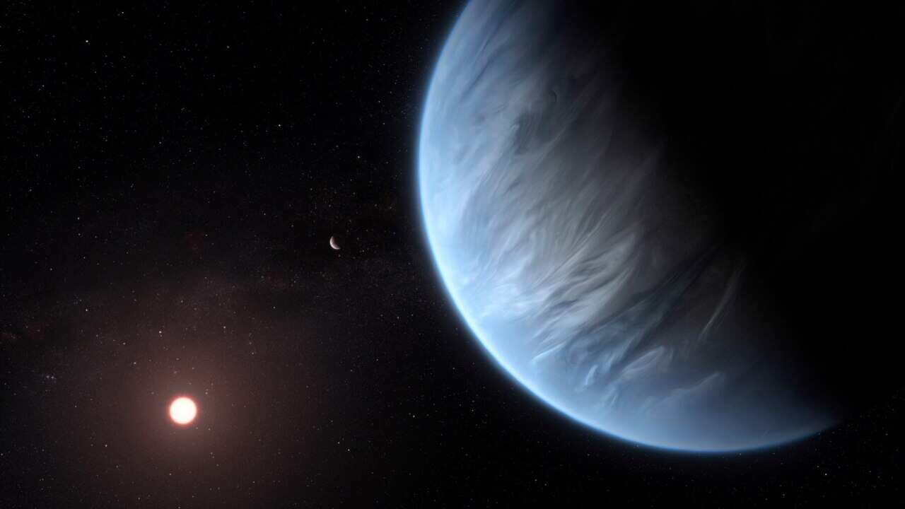 An artist's rendering of Exoplanet K2-18b, foreground, its host star and an accompanying planet in the system