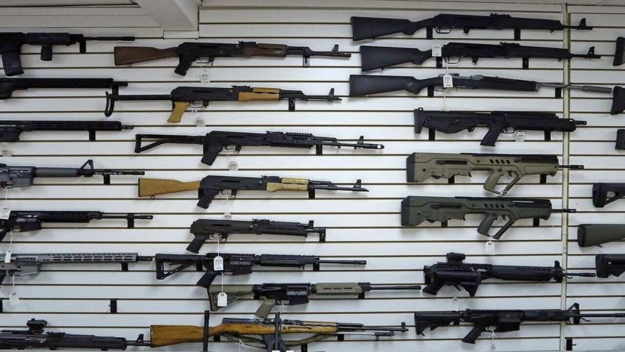 semi-automatic weapons on wall in gun store
