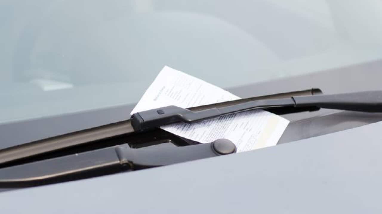parking ticket on car windscreen