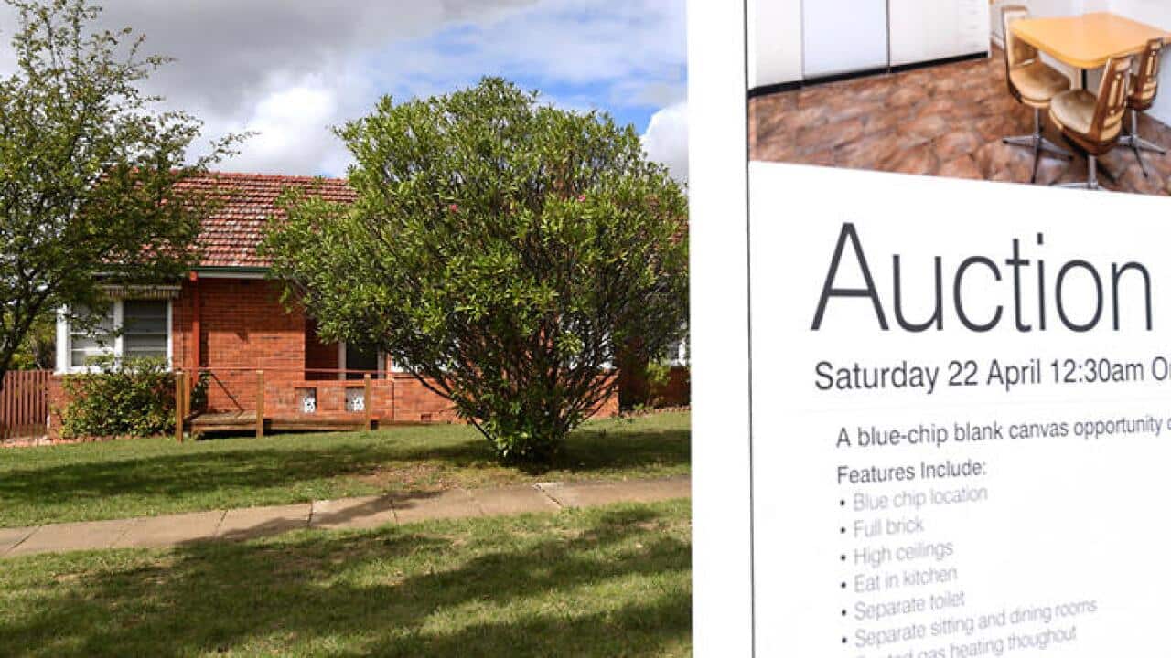 A real estate advertising board is seen in Canberra, Tuesday, April 4, 2017. (AAP Image/Lukas Coch) NO ARCHIVING