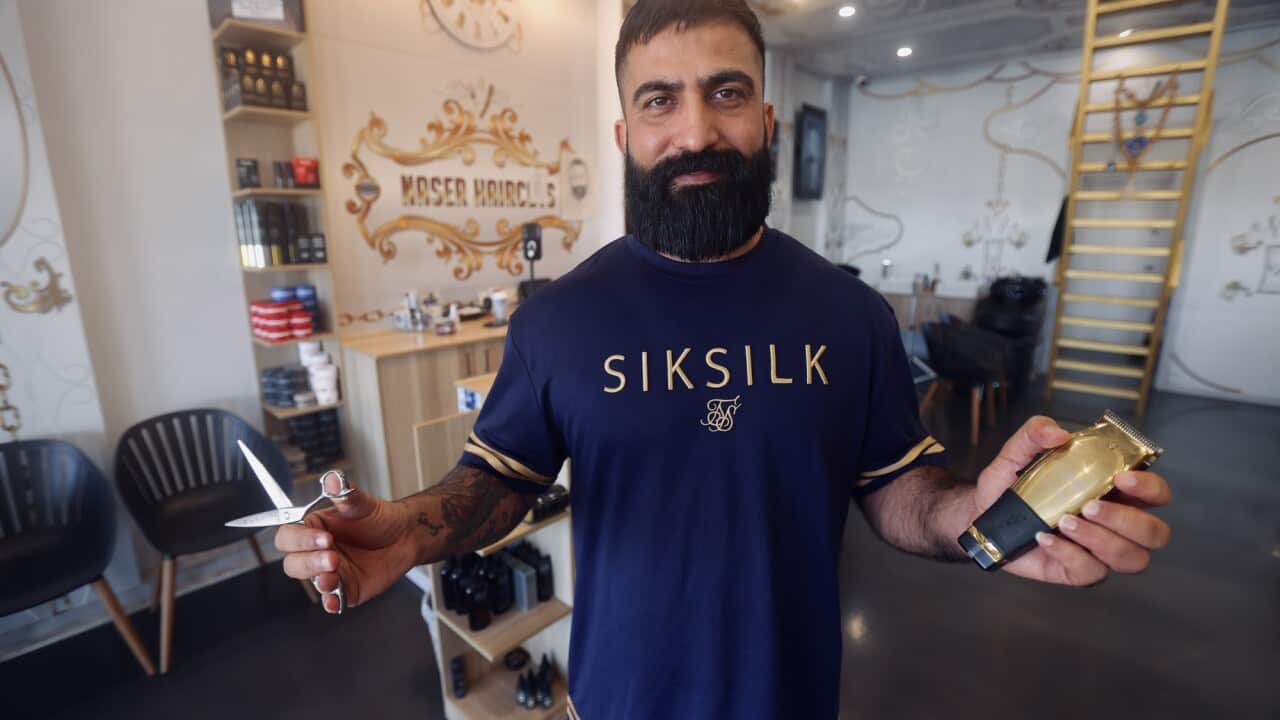 Barber shop owner Hussein Naser in the new federal electorate of Bullwinkel says trust is a critical issue_photo credit_Christopher Tan_SBS.jpg