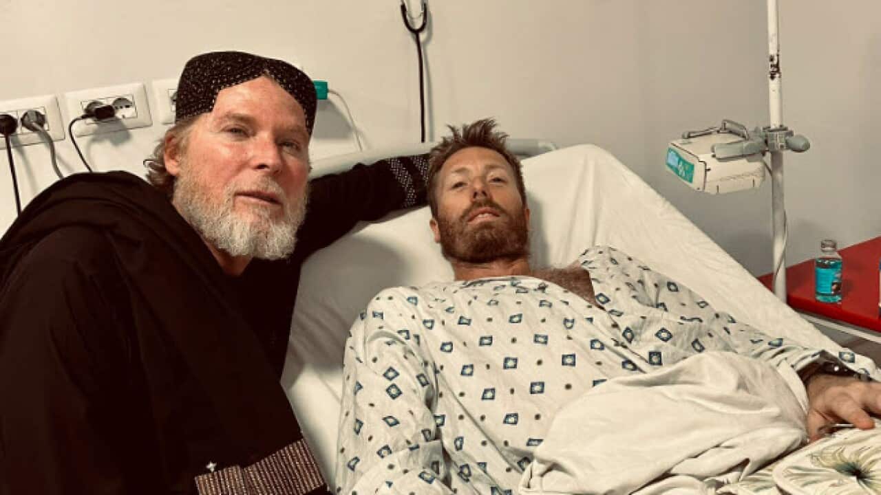 A man lying in a hospital bed