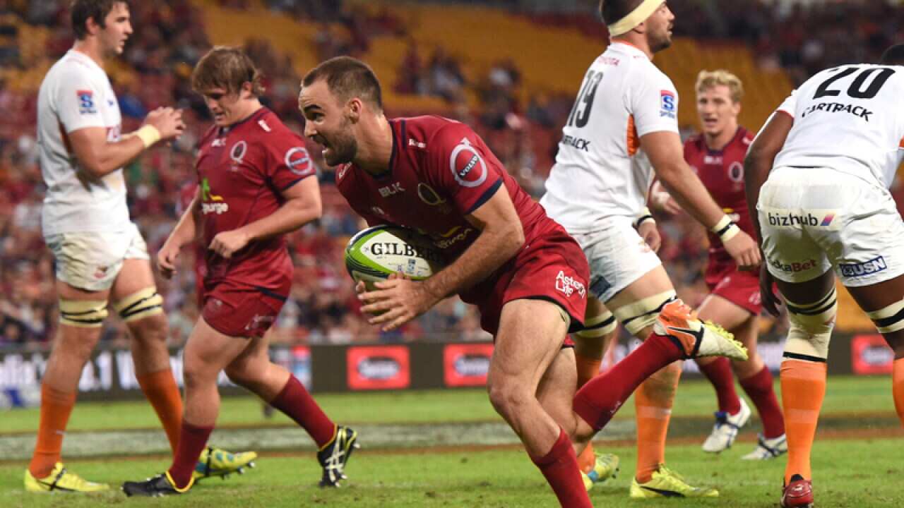 Reds player Nick Frisby crosses over to score a try