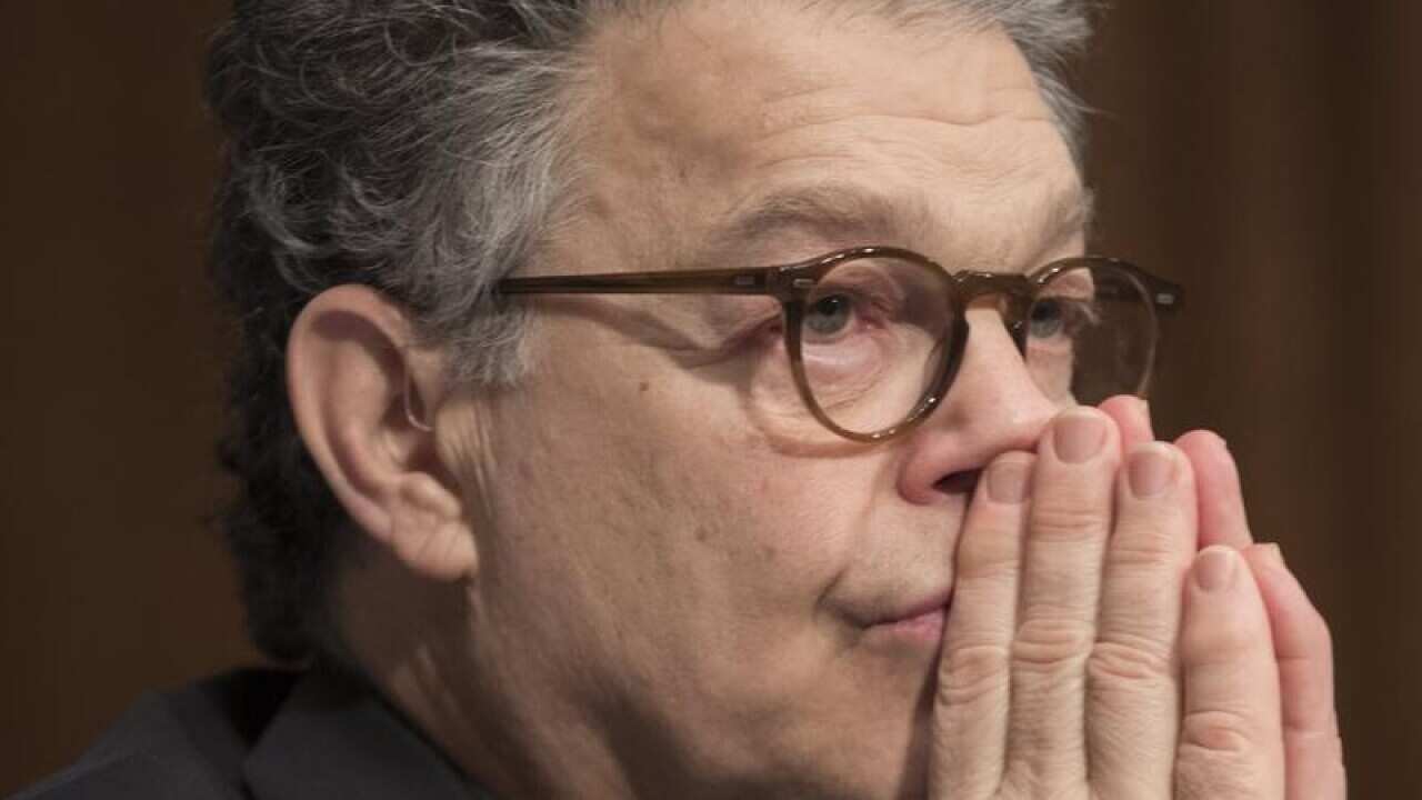 Senator from Minnesota Al Franken attends a Senate Committee.