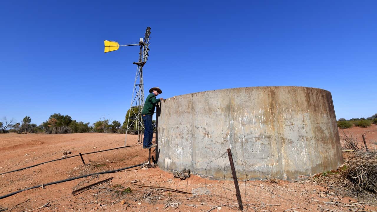 Pastoralist Lachlan Gall checks the water tank on his property at Langawirra Station north of Broken Hill, New South Wales, Monday August 20, 2018