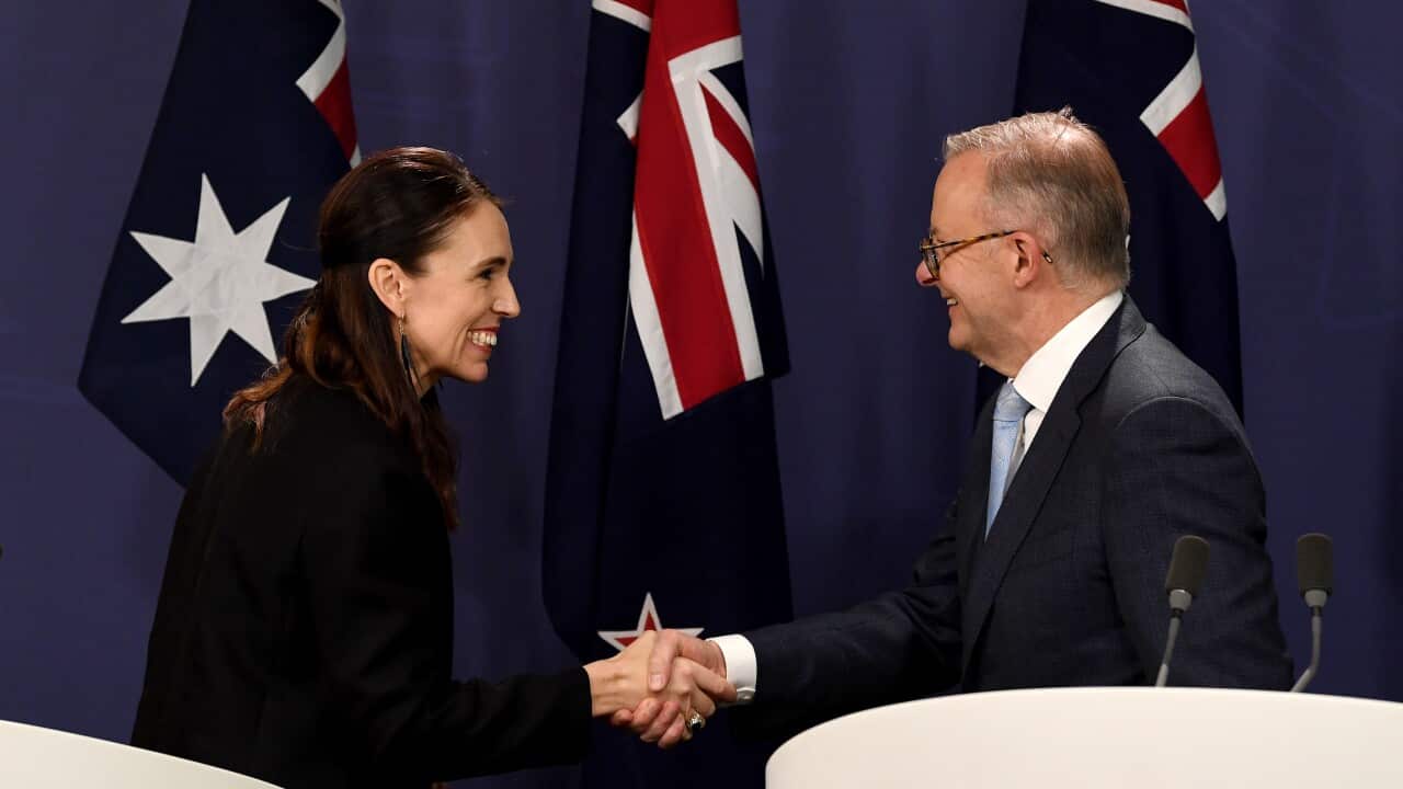 New Zealand Prime Minister Jacinda Ardern (left) and Australian Prime Minister Anthony Albanese shakes hands after speaking to the media during a press conference in Sydney, Friday, July 8, 2022. (AAP Image/Bianca De Marchi) NO ARCHIVING