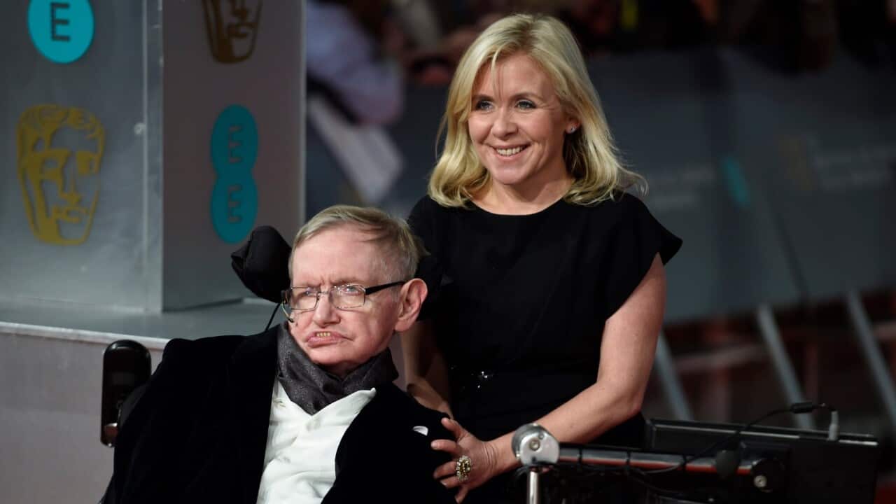 British scientist Stephen Hawking (L) and his daughter Lucy Hawking (R) arrive on the red carpet for the 2015 British Academy Film Awards