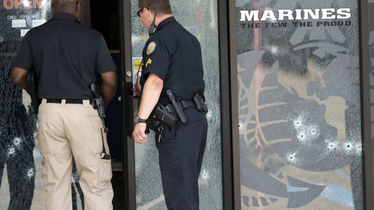 Police officers after a gunman opened fire, in Chattanooga, Tenn.