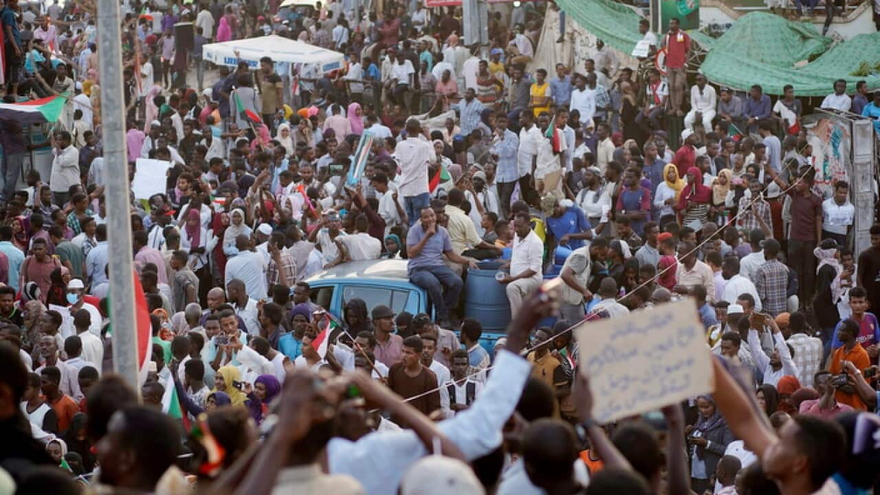 Protesters in Khartoum after reports that Sudan's President Omar al-Bashir had been arrested