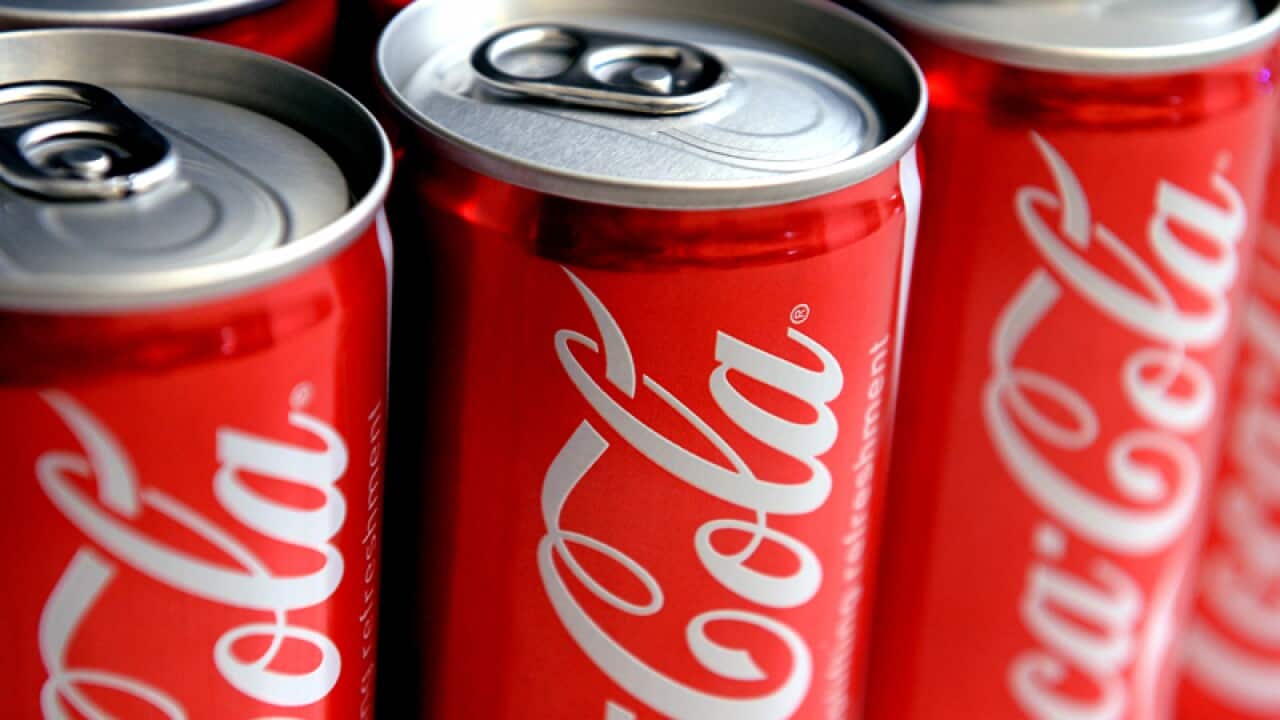 A stock image of cans of Coca Cola