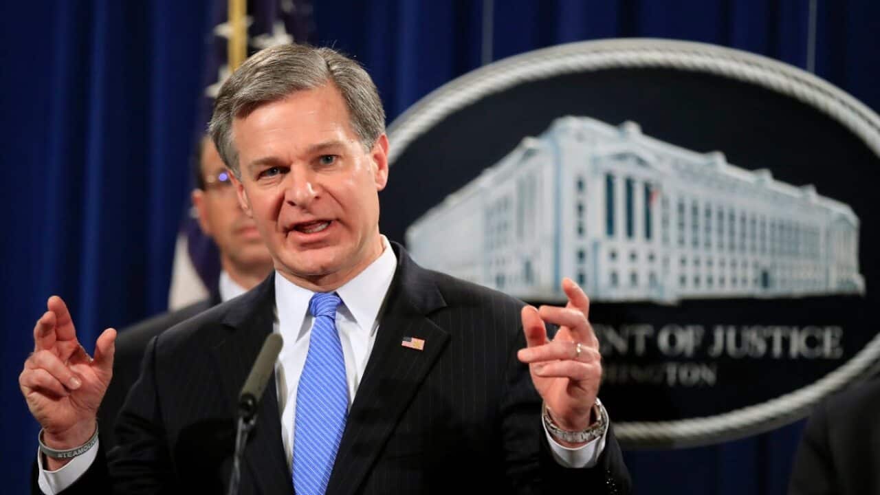 FBI Director Christopher Wray speaks during a news conference at the Department of Justice