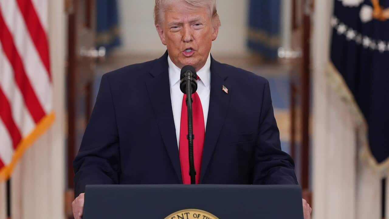 US President Donald Trump speaking while standing at a lectern.